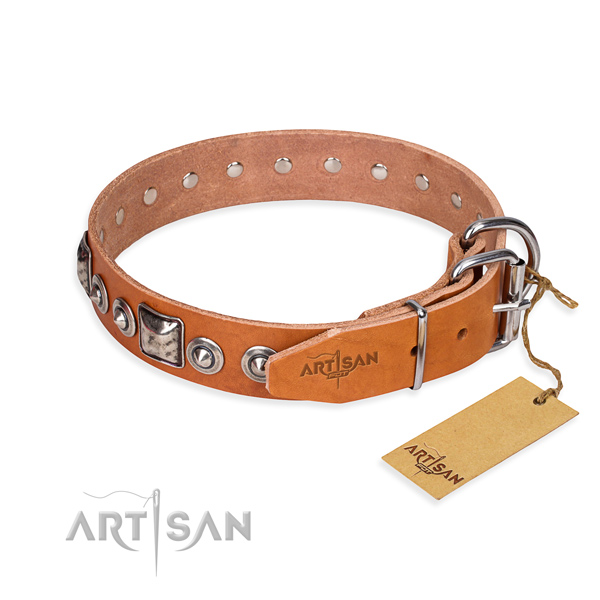 Leather dog collar made of flexible material with rust-proof adornments